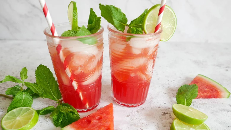 glasses of iced watermelon drink with mint and lime