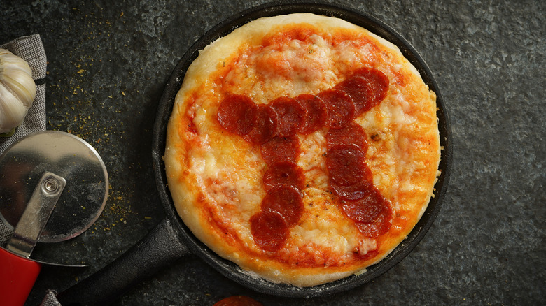 pizza with pepperoni pi symbol