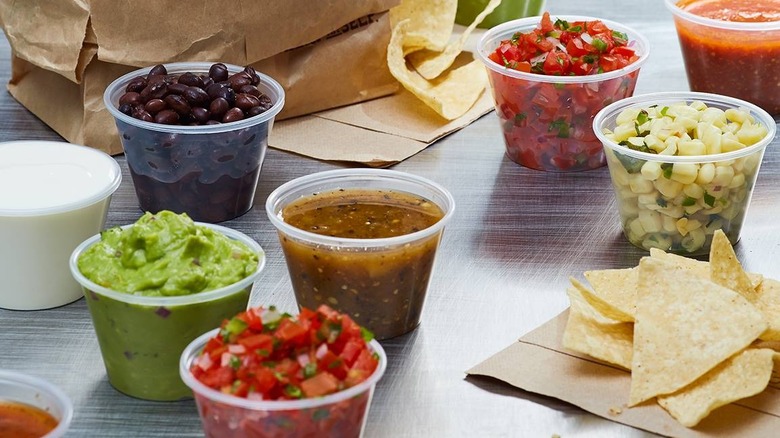 chips, guacamole, sour cream, black beans, and salsa