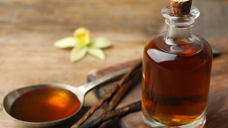 bottle and spoon with homemade vanilla extract