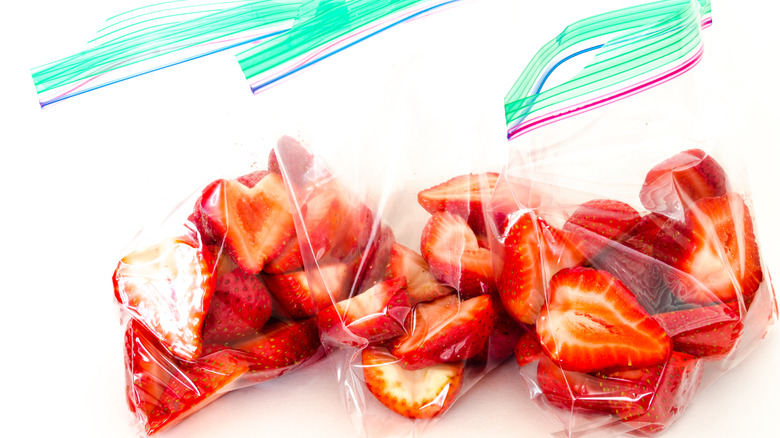 Sliced strawberries in plastic bags