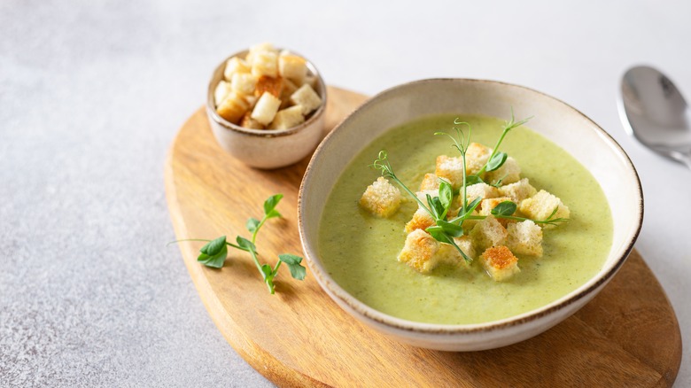 soup with croutons and pea shoots