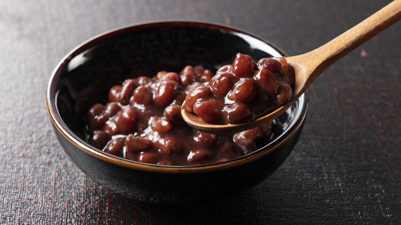 spooning adzuki beans from bowl