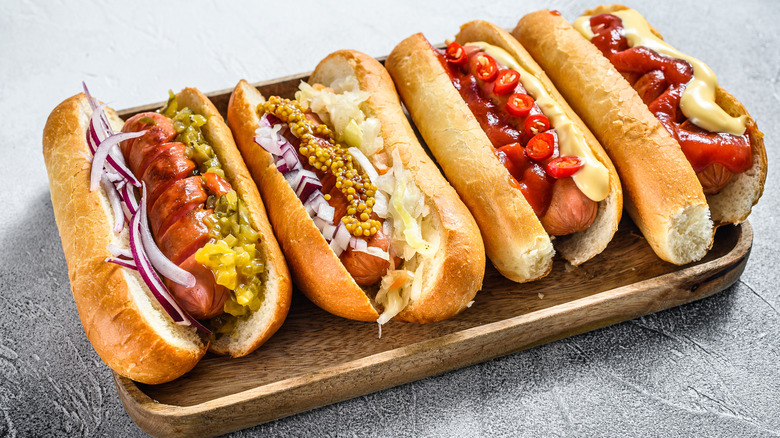 Four Frankfurters on a board