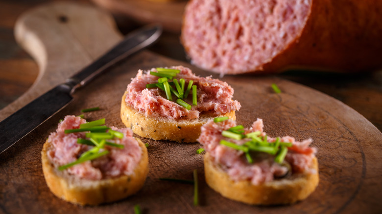 Teewurst spread on crusts of bread