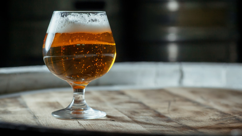 Snifter glass filled with beer 