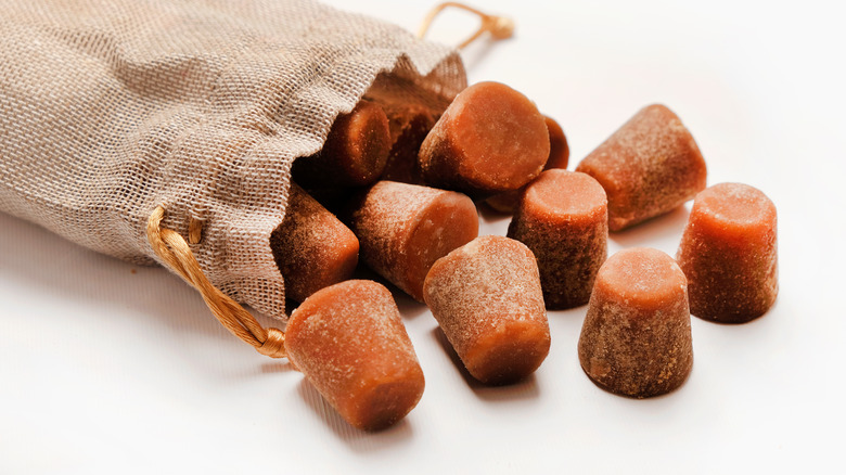 cubes of jaggery spilling out of bag