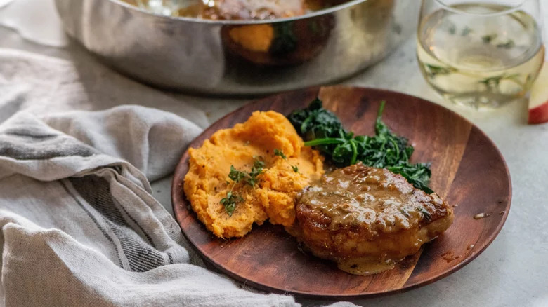 apple cider pork chops with spinach and mashed sweet potatoes