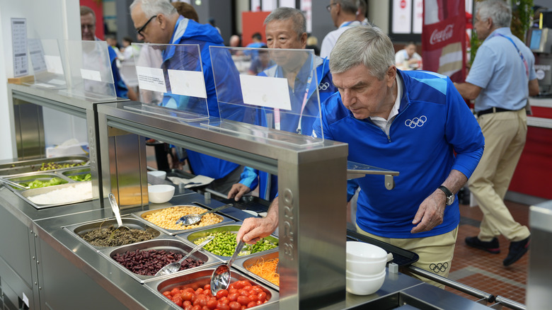 IOC President Thomas Bach tries food bar for 2024 Paris Olympic