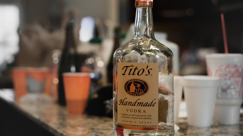 tito's vodka bottle with drinks