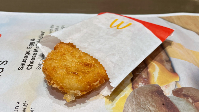 Hash brown in paper sleeve