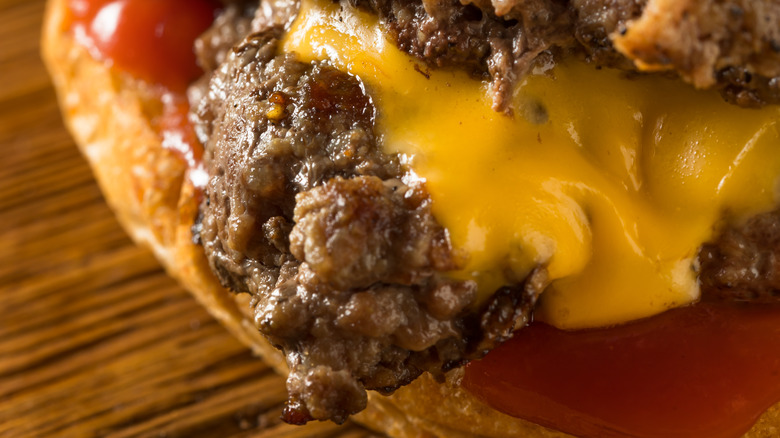 closeup of a cheese-topped smash-burger