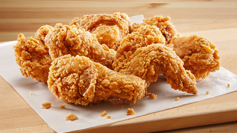 Fried chicken on a wooden board