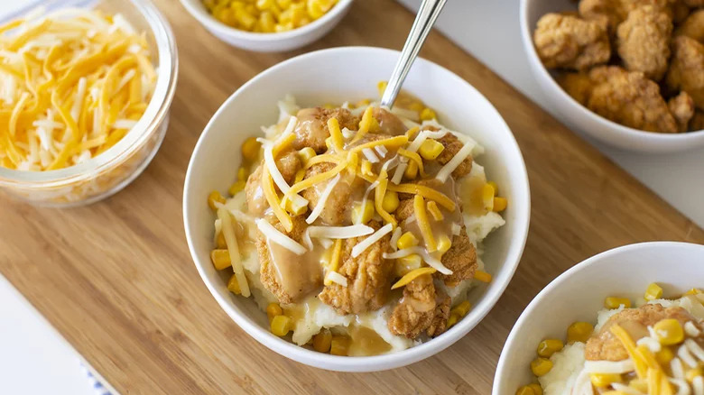 Fried chicken bowls with corn, mash, gravy, and cheese