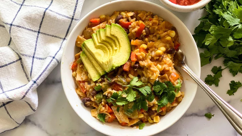 Mexican rice bowl with avocado slices