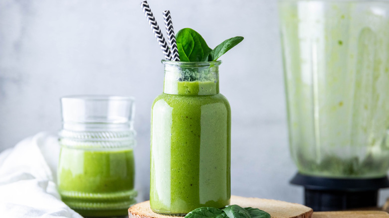 Green smoothie glass and blender