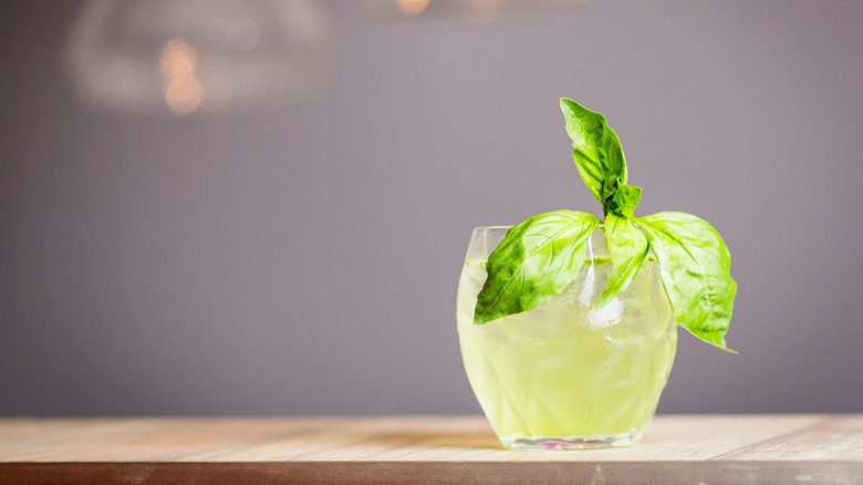 Cocktail garnished with basil