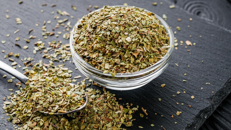 bowl of oregano with spoon