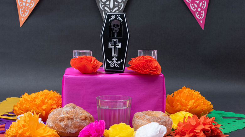 day of the dead altar mezcal flowers