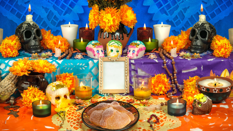 day of the dead altar sugar skulls candles pan de muertos