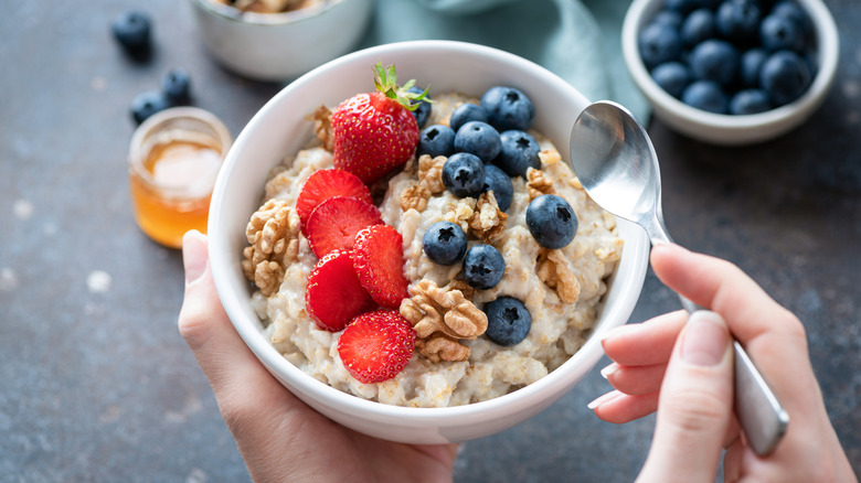 bowl of oatmeal with berries and nuts