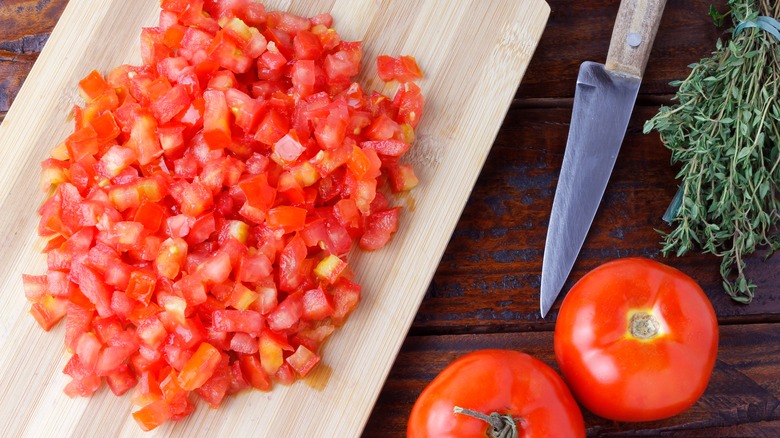 diced tomatoes on chopping board