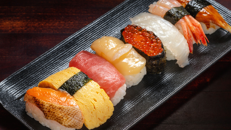 Assortment of nigiri on plate