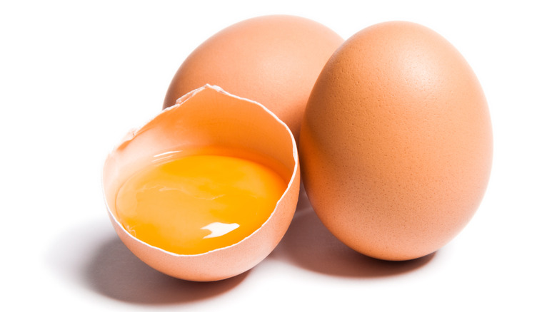 brown eggshell with an egg yolk