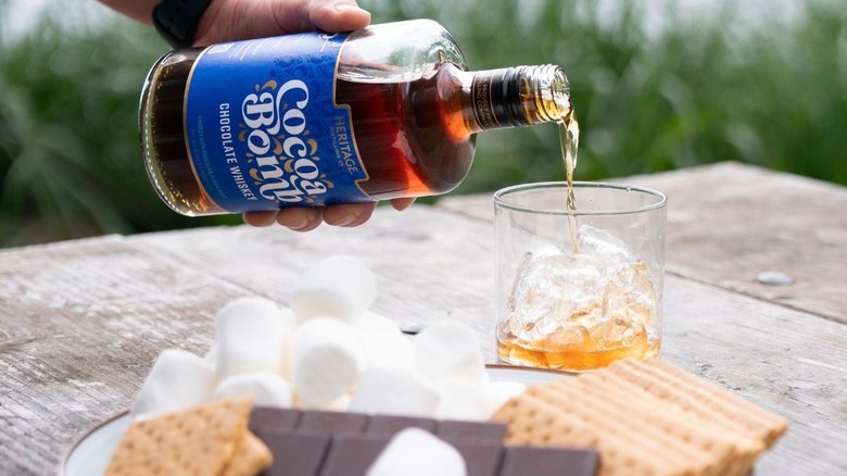 pouring Cocoa Bomb over ice