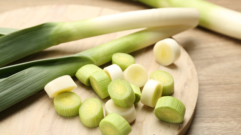 leeks chopped up on wooden board