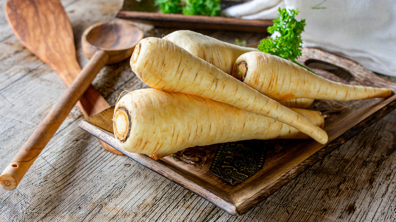 parsnips on wooden tray