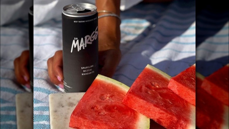 MARGS Sparkling Mezcal Margarita can and watermelon slices