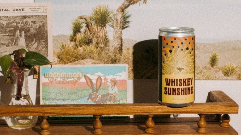 Slow and Low Whiskey Sunshine can on shelf by memorabilia