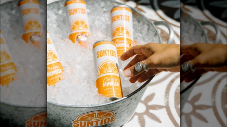 Suntide Classic Mimosa canned cocktails over ice