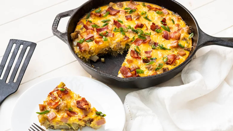 Ham and egg skillet breakfast with bacon and sausage