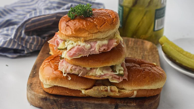 Bread roll sliders with ham and cheese and dill pickles