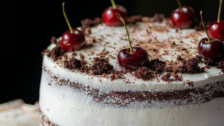 Cherries on top of chocolate cake