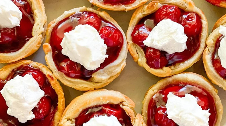 Little cherry-filled tarts with cream