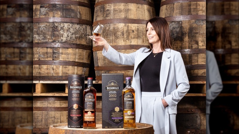 woman toasting Bushmills whiskey