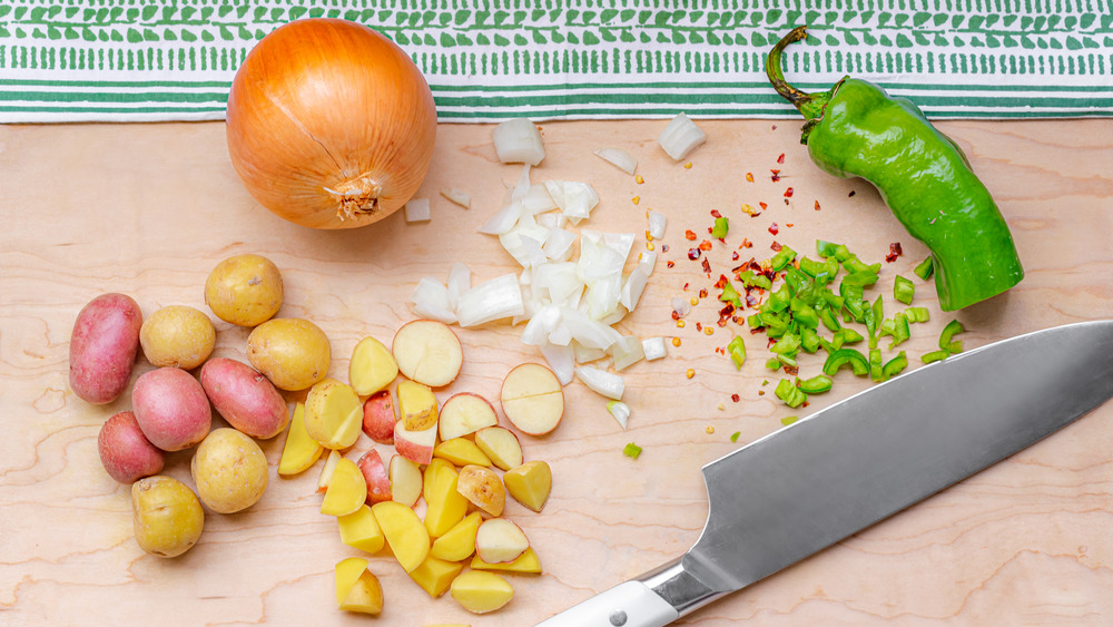 Cutting potatoes and onions