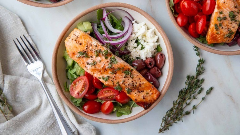 Salmon Greek salad in bowl