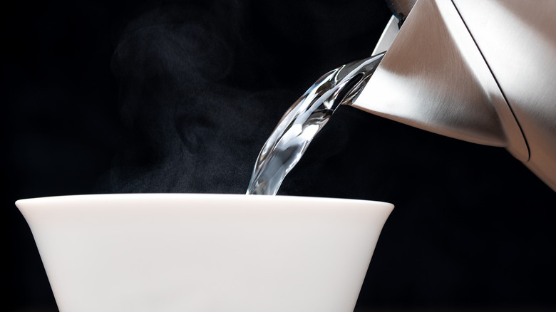 Hot water being poured into a bowl