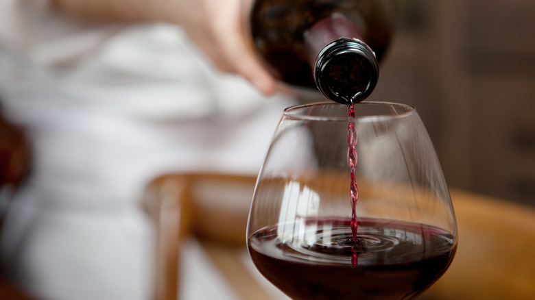 Wine being poured into a wine glass