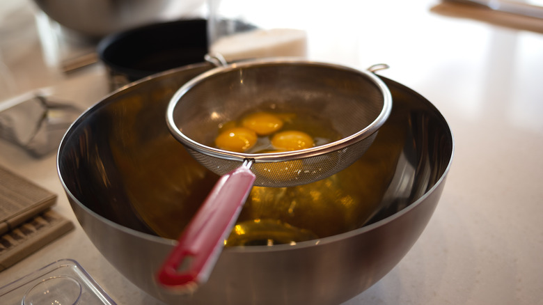 Eggs being strained