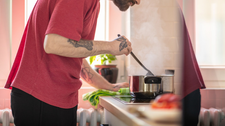 Cook swirling a pot