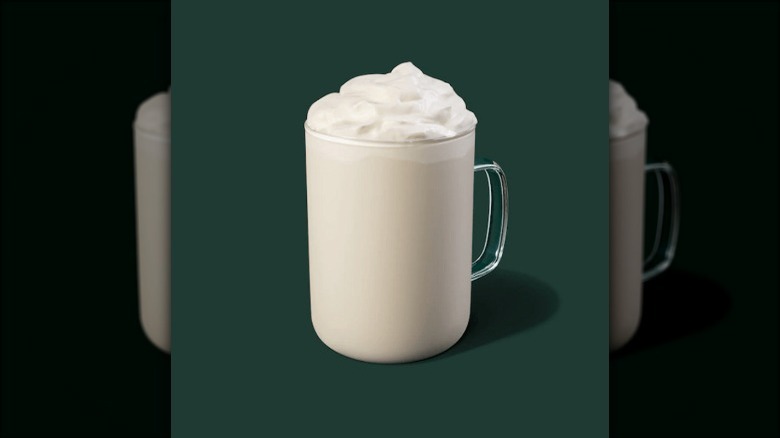 white hot beverage on green background