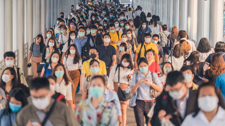 Crowds wearing masks