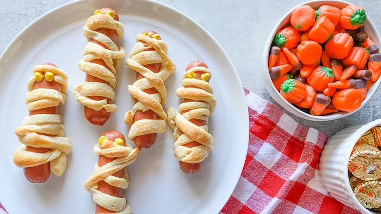 Hot dogs with pastry and mustard and candy