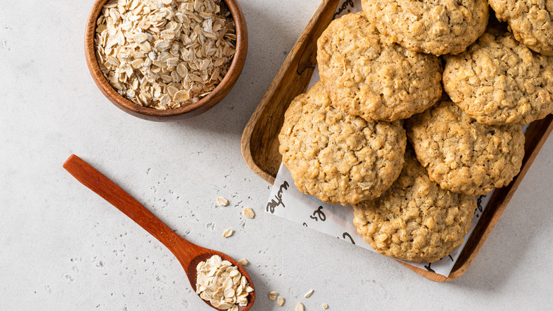 Oatmeal cookies with bowl of oats 