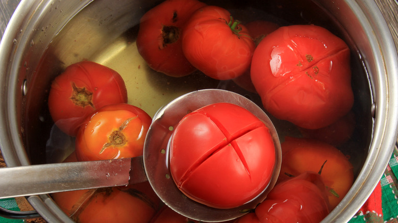 Tomatoes in hot water pan